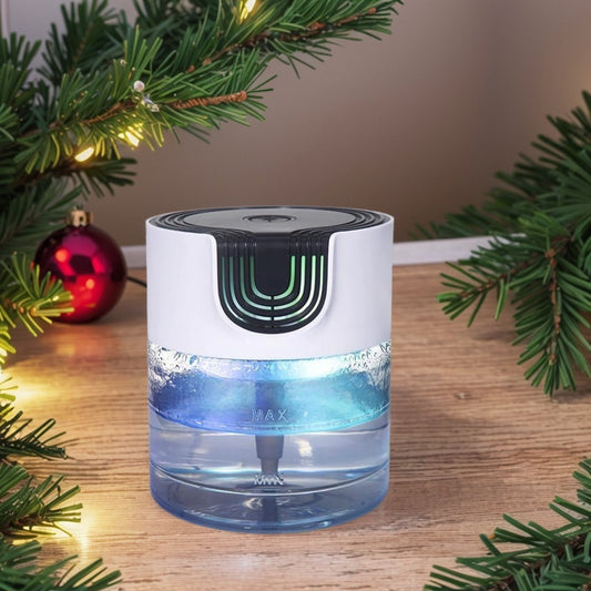 A Zainzio water-based air purifier with blue light and "MAX" / "MIN" markers sits on a wooden table, framed by festive evergreen decor.