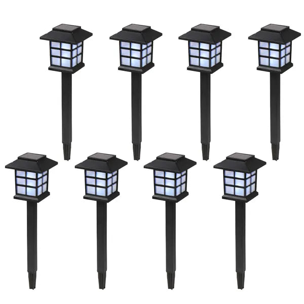 Set of eight solar-powered garden lights on black stakes with a white background