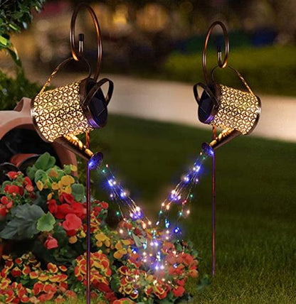 Decorative garden lights with colorful string lights on a grassy background