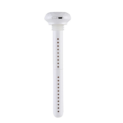 A white USB stick humidifier stands vertically, featuring a faceted top with a visible USB port. The long, slender body has two sections, both perforated with small holes.