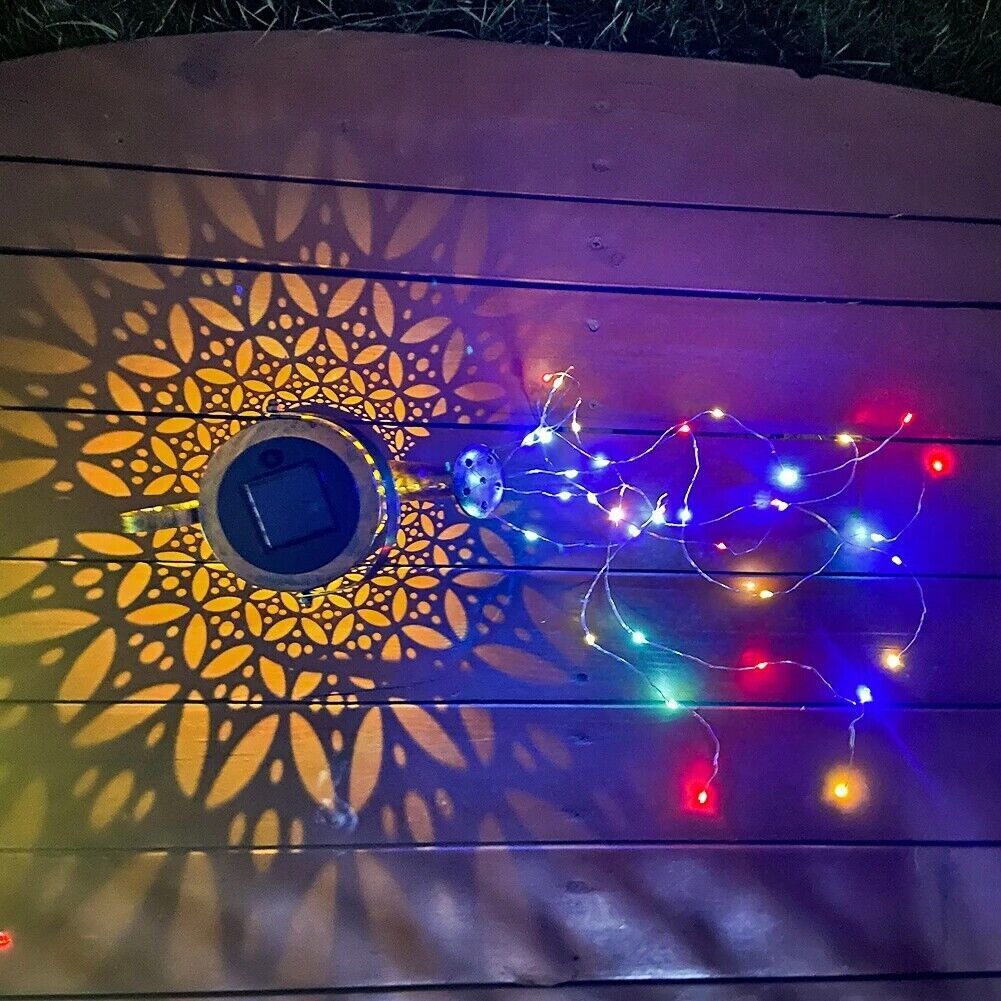 String lights on a wooden surface with decorative patterns