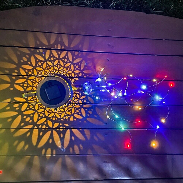 String lights on a wooden surface with decorative patterns