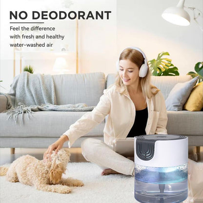 A woman pets her dog in a cozy living room next to a Zainzio water-based air purifier. Text: NO DEODORANT. Feel the difference with fresh and healthy water-washed air.