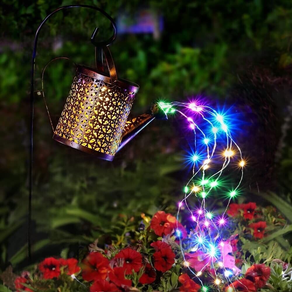 Solar-powered lantern with colorful string lights in a garden setting