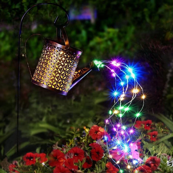 Solar-powered lantern with colorful string lights in a garden setting