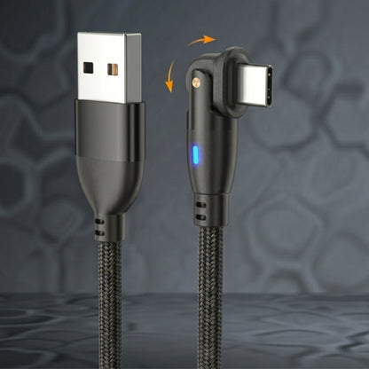 A black braided charging cable features a 180° rotating Type-C connector with a blue LED indicator, alongside a standard USB-A plug. This highlights the cable's versatile design.