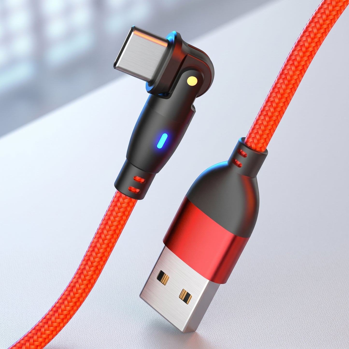 A vibrant red braided USB-C gaming cable features a 180-degree rotating connector with a blue LED light and a matching USB-A end.