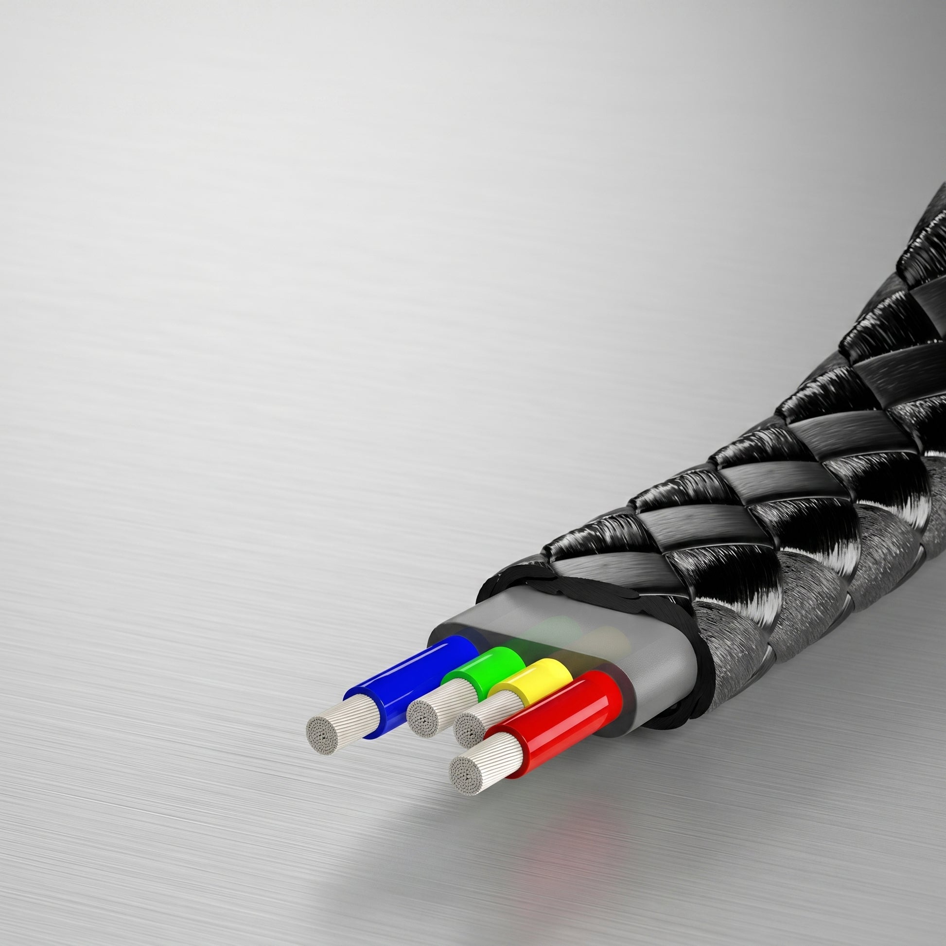 A close-up of a black braided cable's cross-section, revealing four internal colored wires (blue, green, yellow, red) on a brushed metal background.