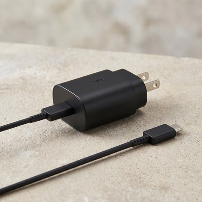 The black 25W USB-C Super Fast Wall Charger with its attached 6FT cable is displayed on a textured surface, highlighting its design.