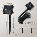 Solar garden stake light shown with dimension labels, including a single assembled unit, a coiled bundle of black wires, and a string of small bulbs. Text on the image reads 7cm/2.