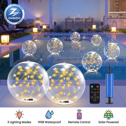 Solar-powered floating LED fairy lights in clear spherical balloons, shown floating on a swimming pool at night with a remote control, blue hand pump, and product features icons. A ZAINZIO brand logo is visible in the top left.