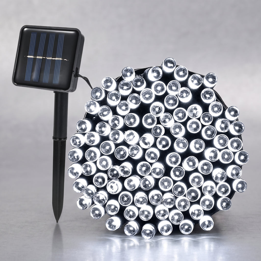 A solar-powered LED light string with a black stake-mounted solar panel on the left and a dense cluster of clear dome-shaped LED bulbs on the right, set against a neutral gray background.