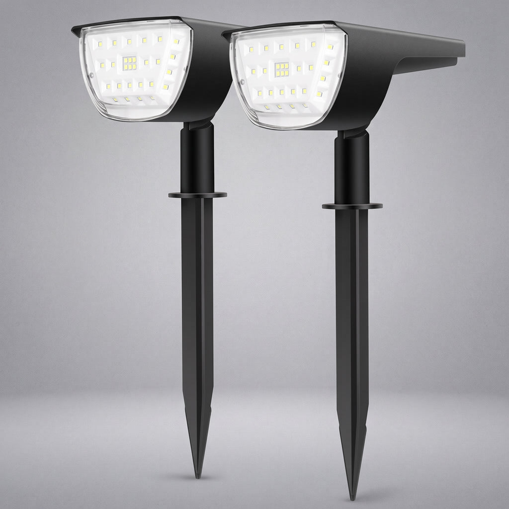 Two black solar-powered stake-mounted LED garden lights shown side by side against a neutral gray background.