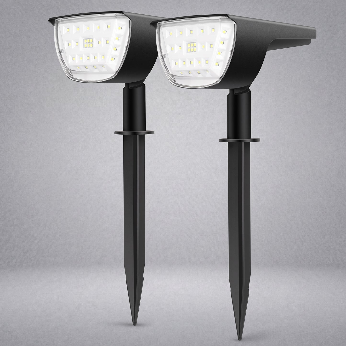 Two black solar-powered stake-mounted LED garden lights shown side by side against a neutral gray background.