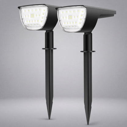 Two black solar-powered stake-mounted LED garden lights shown side by side against a neutral gray background.
