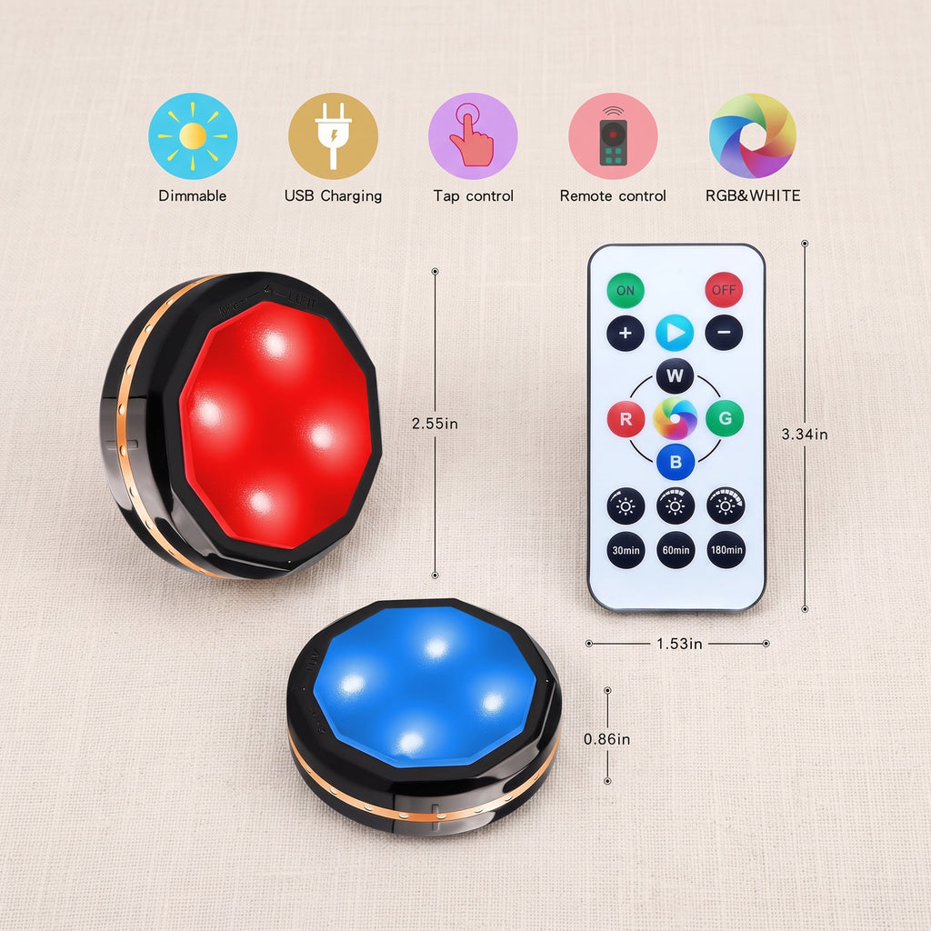 Two Zainzio wireless RGB puck lights, one red and one blue, are shown with their remote control and feature icons. Features: Dimmable, USB Charging, Tap control, Remote control, RGB&WHITE. Dimensions: 2.55in, 3.34in, 1.53in, 0.86in. Remote buttons: ON, OFF, W, R, G, B, 30min, 60min, 180min.