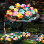 Colorful LED flower lights on a stone base in a garden setting.