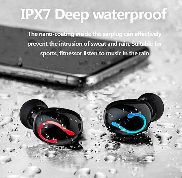 Black wireless earbuds with water resistance features on a wet surface.