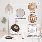 A floor lamp with a gold-toned metal frame, clear octagonal crystal shade, marble-texture black base, and foot switch button, shown with callout circles labeling features such as clear crystal, adjustable height, marble texture base, and E12 base.