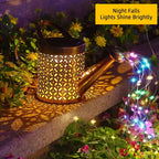 Decorative lantern with string lights on a stone ledge surrounded by flowers