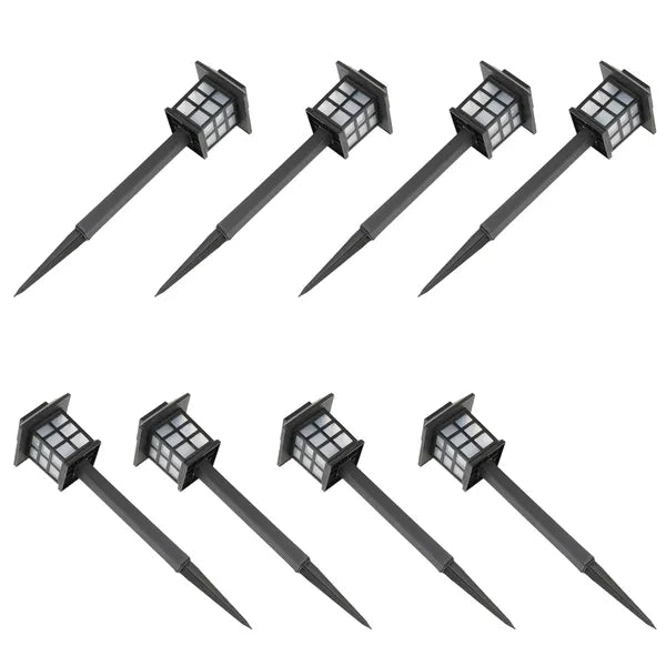 Set of eight black solar-powered outdoor lights on a white background