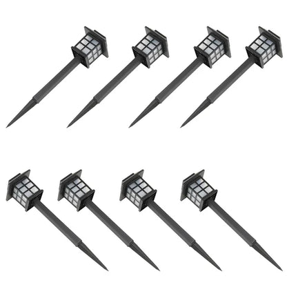 Set of eight black solar-powered outdoor lights on a white background