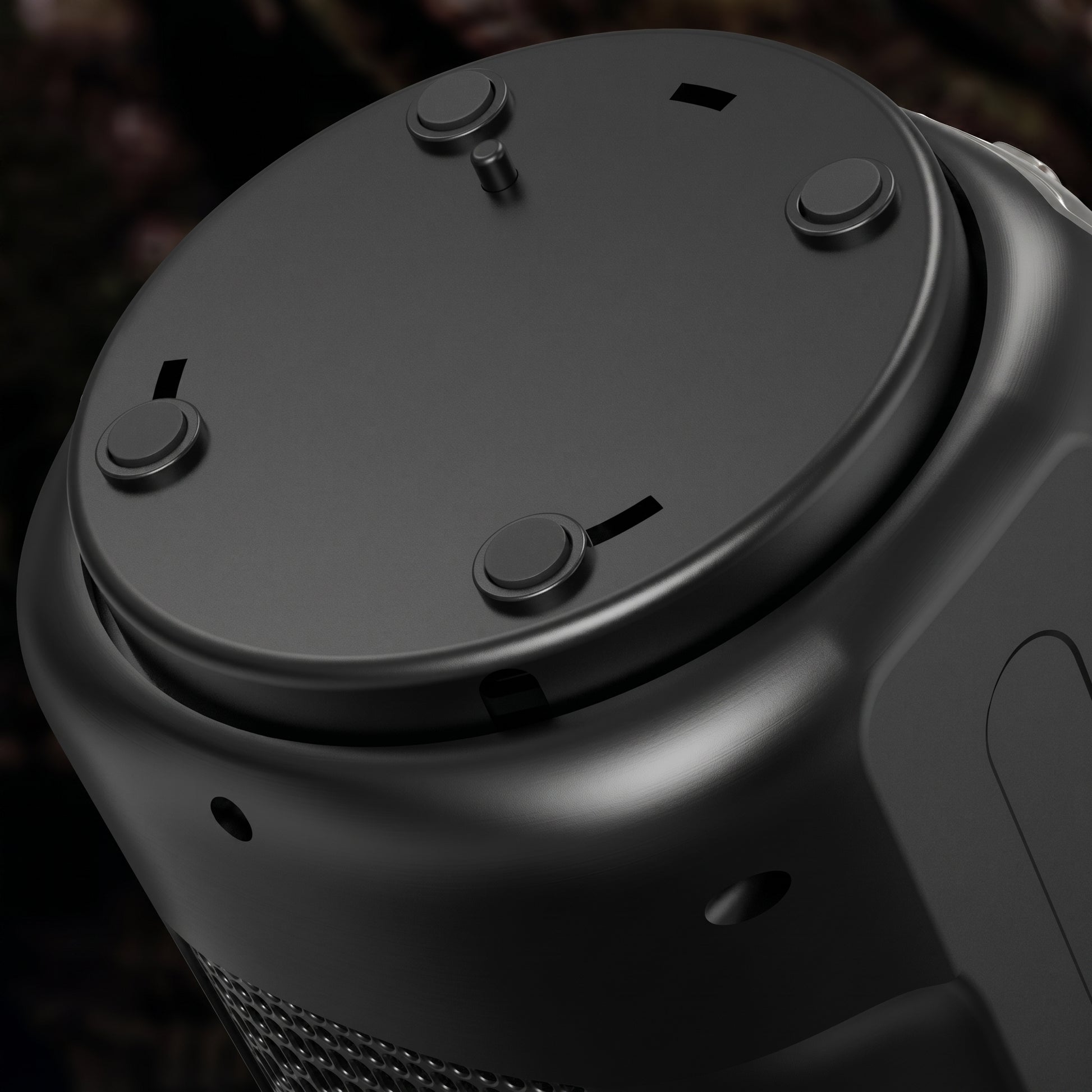 A close-up of the black Zainzio 2-in-1 heater/humidifier's top, showing several control buttons and small slots. A textured grille is visible on the side of the device.