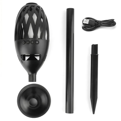 Components of a black Zainzio LED Flame Wireless Speaker Torch, including the speaker unit, a ground stake, a pole, a base, and a USB cable, are displayed on a white background.