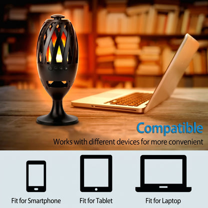 A flame-effect wireless speaker stands next to a laptop, illustrating its broad compatibility. Text reads: "Compatible. Works with different devices for more convenient. Fit for Smartphone, Fit for Tablet, Fit for Laptop.