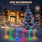 IP55 waterproof, snow-proof, and wind-proof Zainzio outdoor solar candy cane pathway lights shining brightly along a snowy winter walkway.