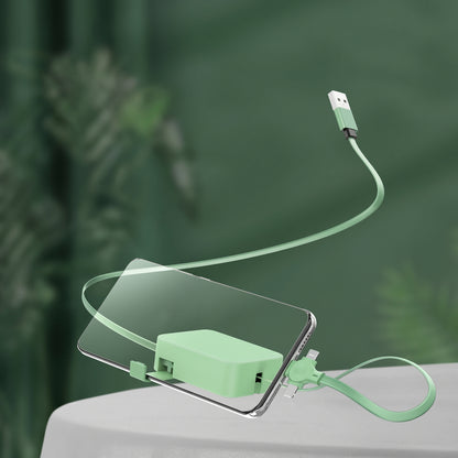 A green Zainzio 4-in-1 retractable cable connects to a smartphone. The cable's USB end floats above, with its compact base attached to the phone.