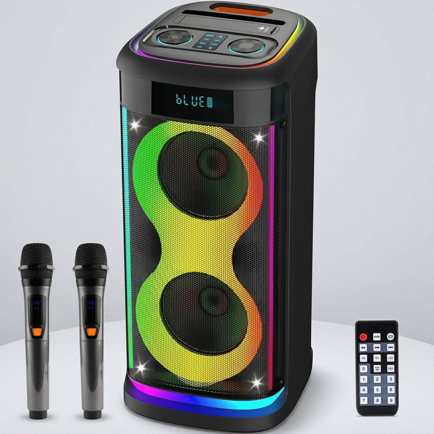A black party speaker glows with colorful RGB lights on its front and edges, shown with two wireless microphones and a remote control. The speaker's display reads "BLUE".