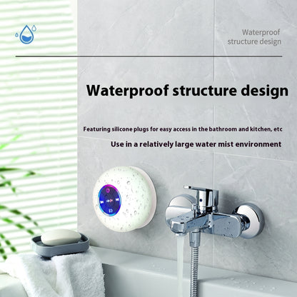 A white, round Bluetooth speaker with colorful LED lights, shown wet and mounted in a bathroom next to a faucet. Text: "Waterproof structure design.