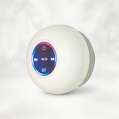 A Zainzio BTS07 white waterproof Bluetooth speaker with a colorful LED control panel and a silver suction cup.