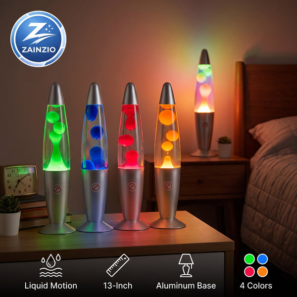 Four ZAINZIO 13-inch aluminum lava lamps in different colors (green, blue, red, orange) displayed on a bedside table in a bedroom setting, with a bed, nightstand, and clock visible in the background.