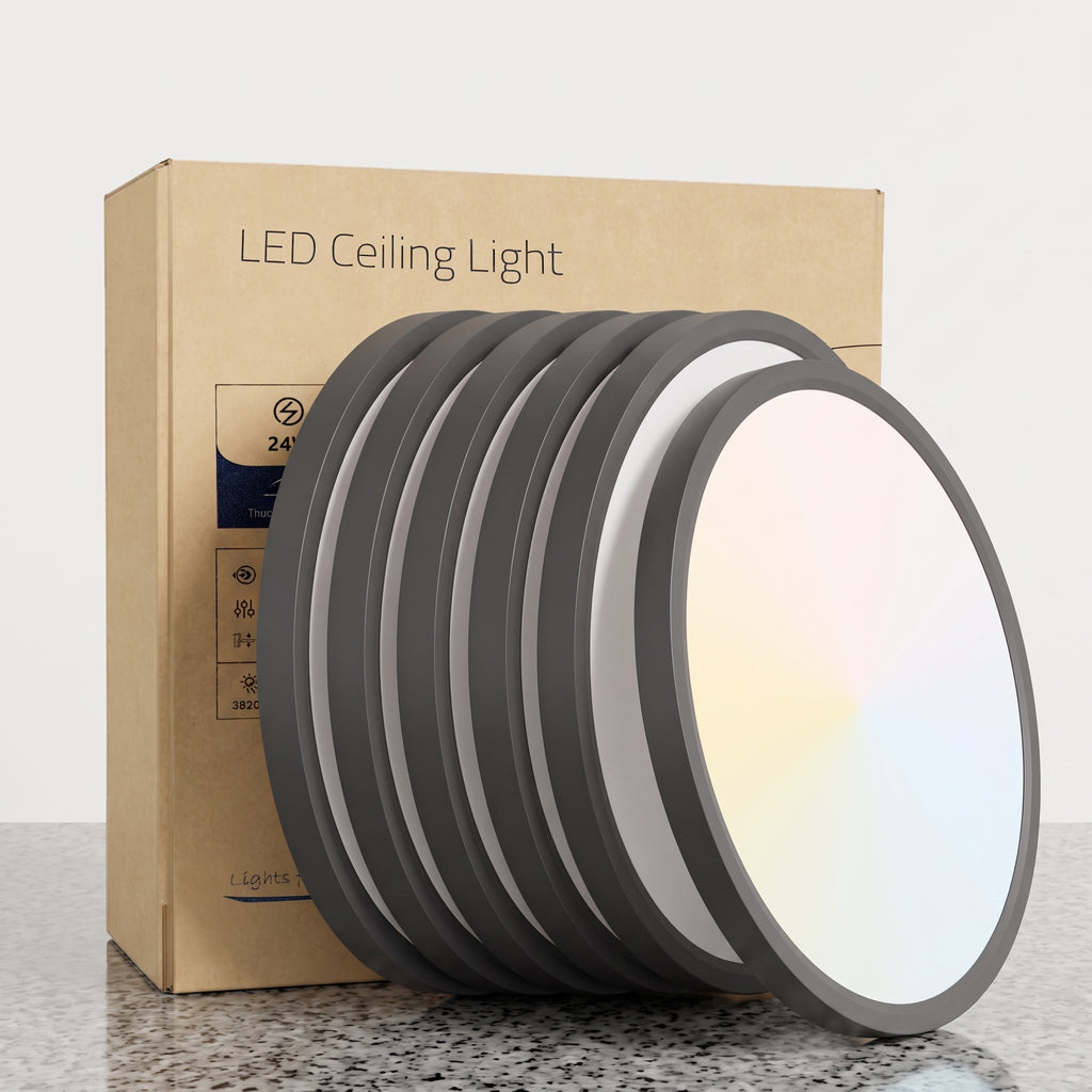 A set of round LED ceiling light panels with dark gray frames and white diffusers, shown leaning in front of their brown cardboard packaging box on a light gray background.