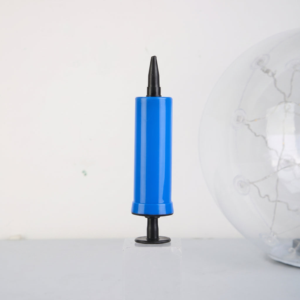 A blue hand pump with a black nozzle and base, standing upright on a light gray surface against a white background, with a clear globe partially visible on the right.