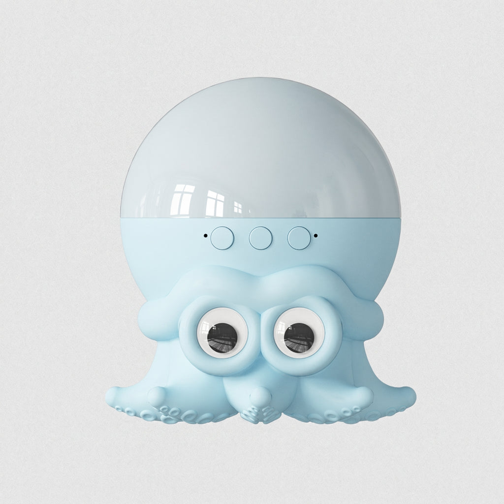 A light blue octopus-shaped speaker with a glossy translucent dome on top, three circular buttons, and large cartoon eyes on the front, shown against a plain light gray background.