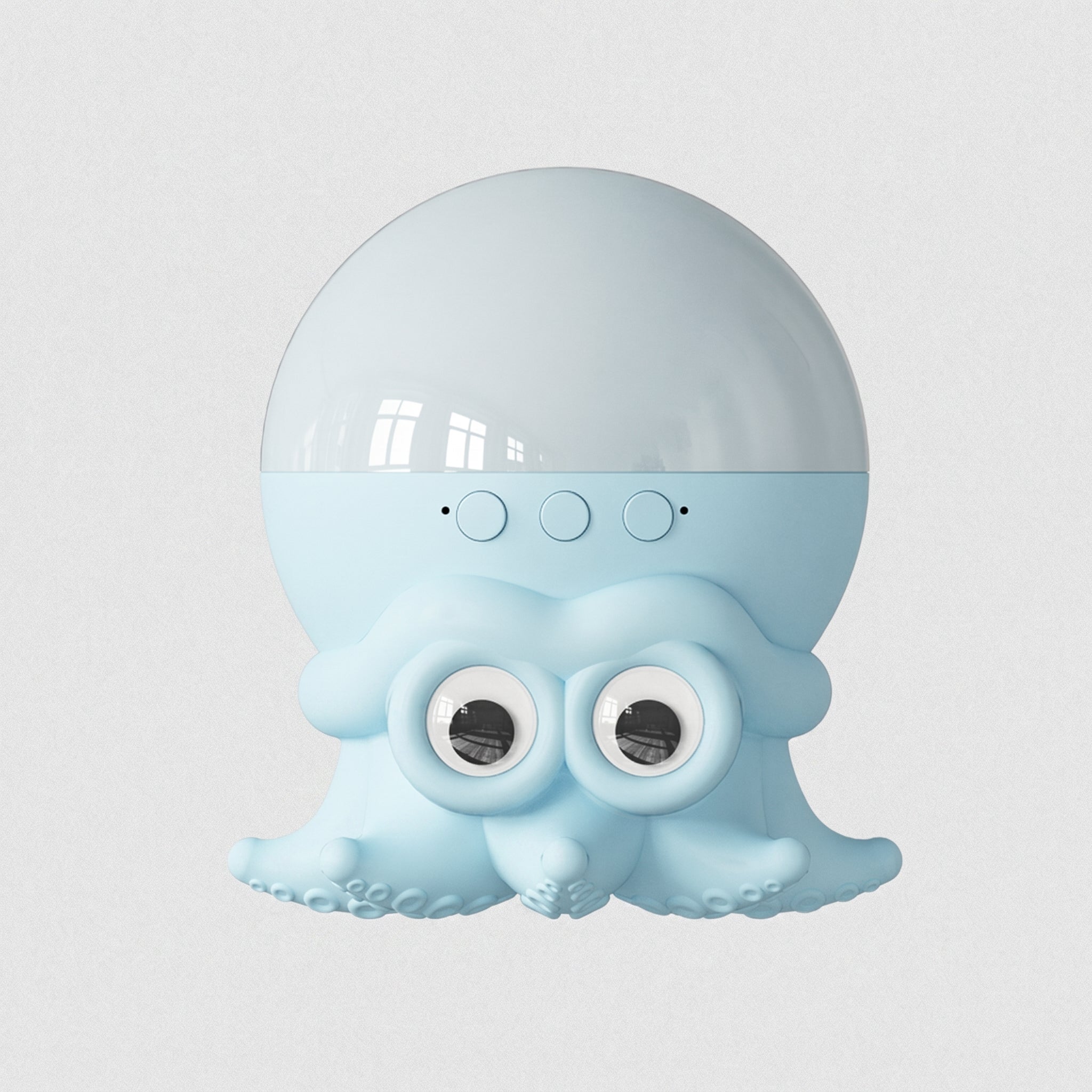 A light blue octopus-shaped speaker with a glossy translucent dome on top, three circular buttons, and large cartoon eyes on the front, shown against a plain light gray background.