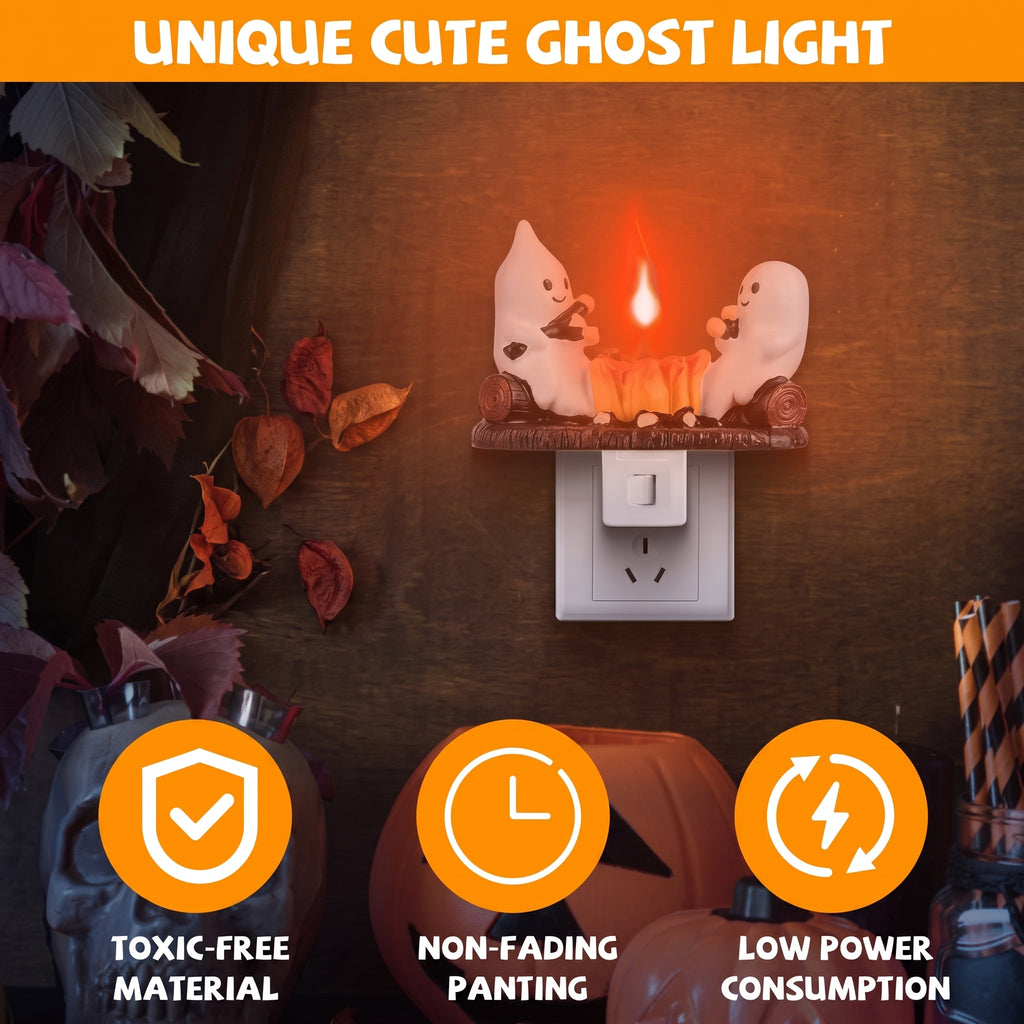 A Halloween-themed ghost night light shown plugged into a wall outlet on a dark wooden surface. The light features two white cartoon ghosts facing each other above a glowing orange pumpkin, with an orange banner at the top reading 'UNIQUE CUTE GHOST LIGHT' and three orange feature icons at the bottom.