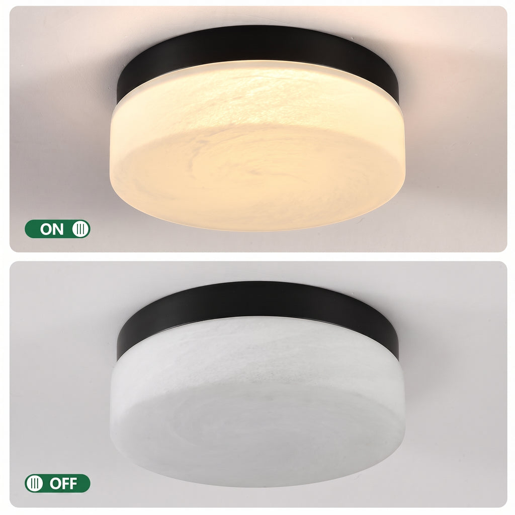 A round flush-mount ceiling light shown in two states: illuminated with a warm white glow in the top panel, and unlit in the bottom panel. The fixture has a black top band and a frosted white glass diffuser.