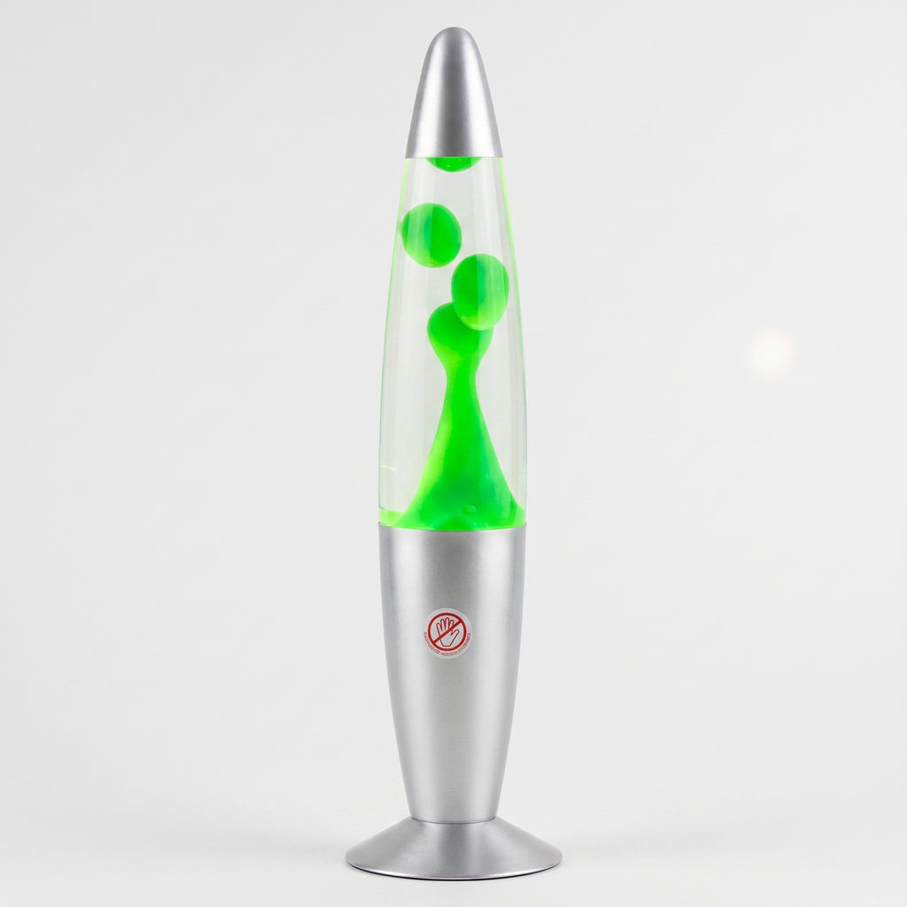A classic lava lamp with a clear glass bulb filled with bright neon green liquid and bubbles, set in a metallic silver base with a red circular warning label.