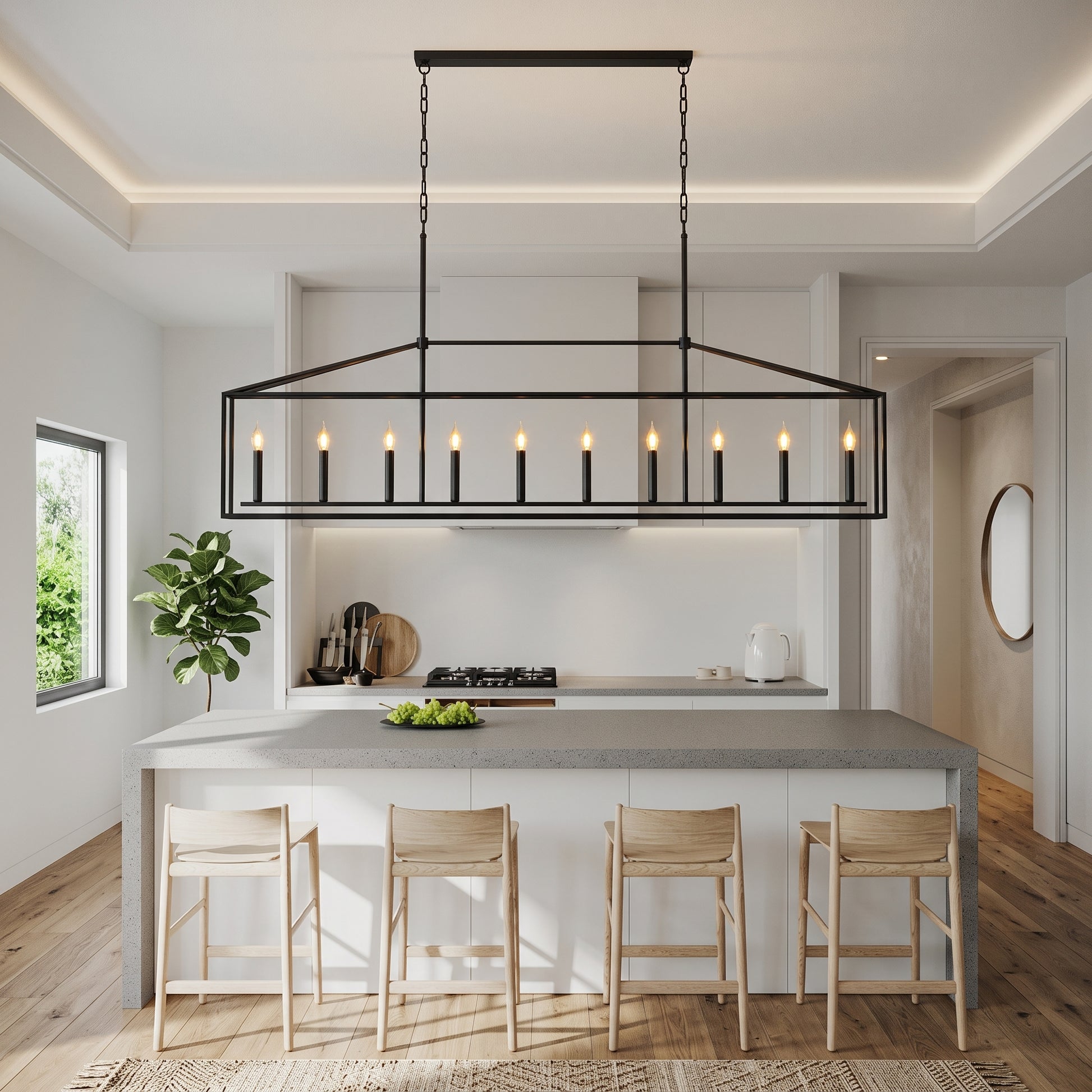 A modern kitchen island with a large black metal rectangular pendant light featuring multiple candle-style bulbs, shown in a bright, contemporary kitchen with four wooden bar stools.