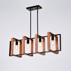 A modern four-light linear chandelier with a black metal frame and warm copper/bronze geometric side guards, suspended from a black ceiling canopy against a light gray background.