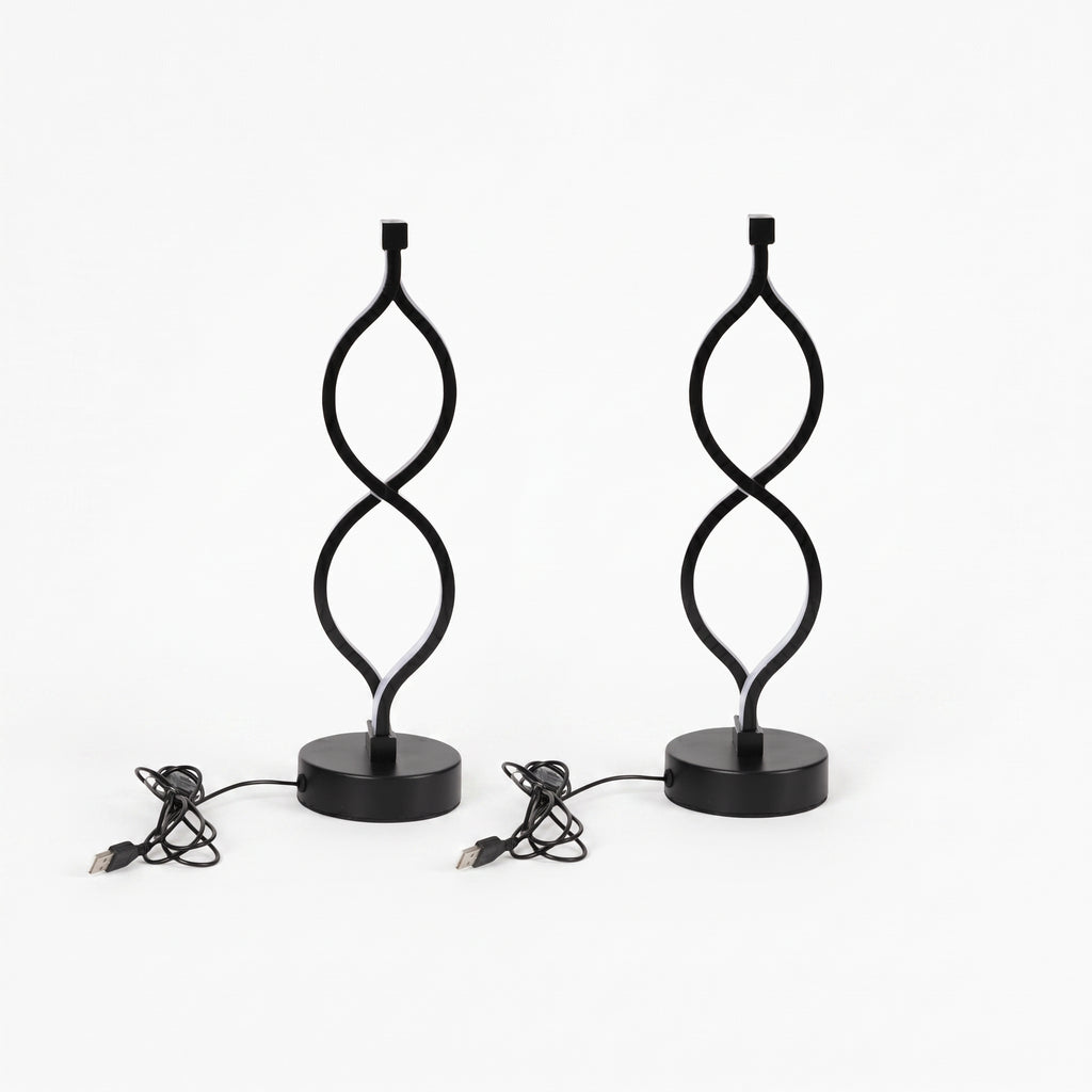 A pair of black Zainzio Spiral LED Table Lamps with a unique twisted design on round bases are shown with their USB power cords.
