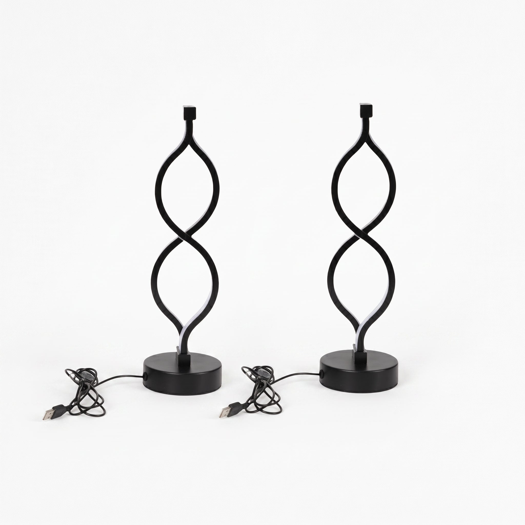 A pair of black Zainzio Spiral LED Table Lamps with a unique twisted design on round bases are shown with their USB power cords.