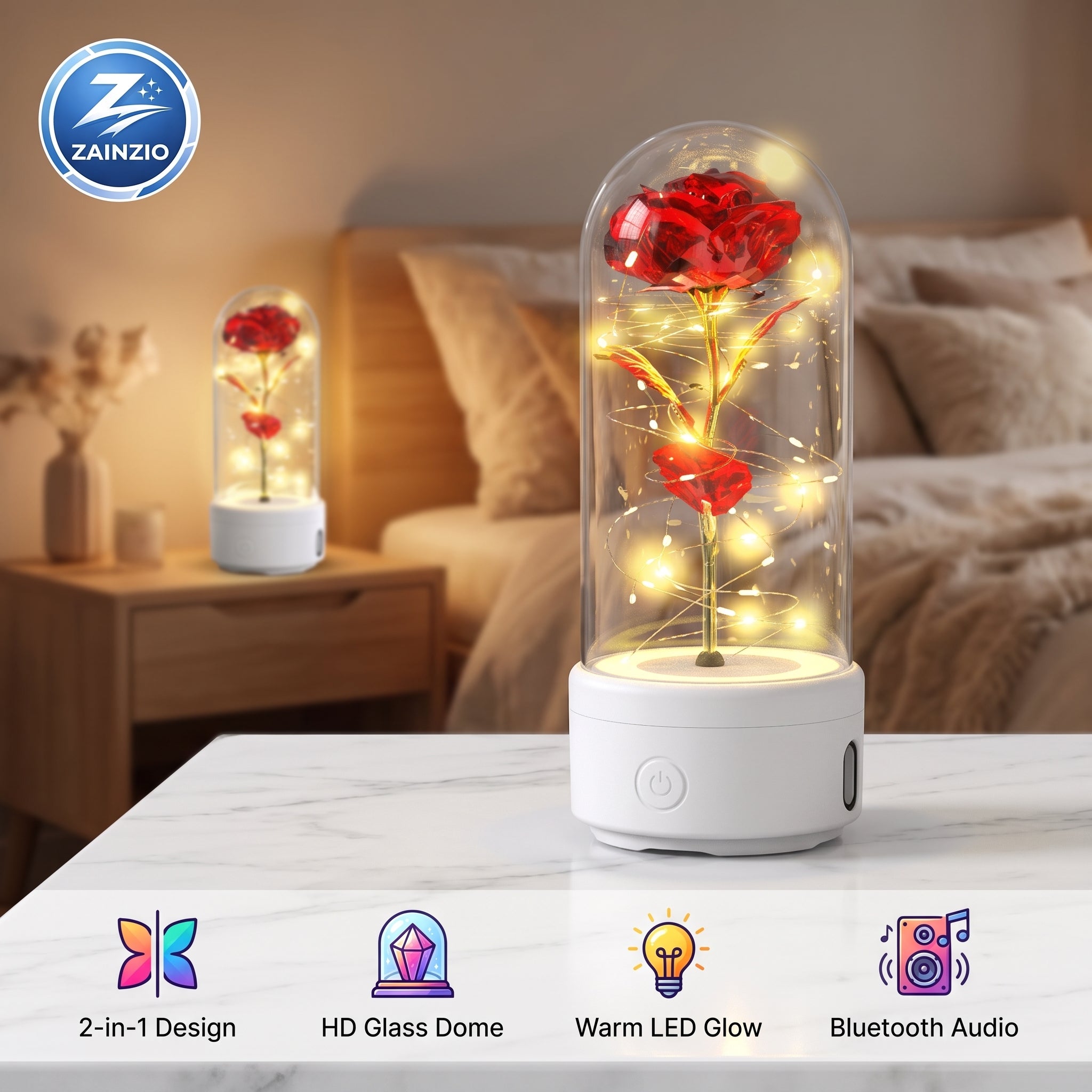A glass dome LED lighted rose night light on a white base, shown lit on a marble tabletop in a bedroom setting with a matching smaller version in the background. Features a ZAINZIO brand logo and feature icons along the bottom.