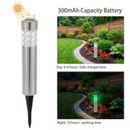 Zainzio RGB solar garden stake lights with stainless steel finish, shown in daylight and glowing green at night.