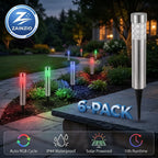 Zainzio 6-pack stainless steel RGB solar garden stake lights glowing with color-changing light along a backyard path.