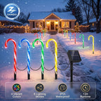 Zainzio 4-pack solar candy cane lights illuminating a snowy pathway with 8 lighting modes and vibrant holiday colors for outdoor Christmas yard decorations.